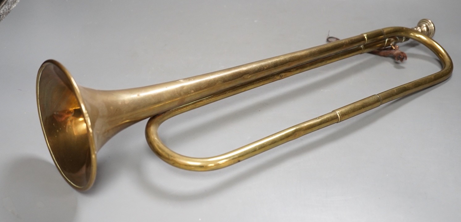 A Premier brass bugle, 51 cms long.